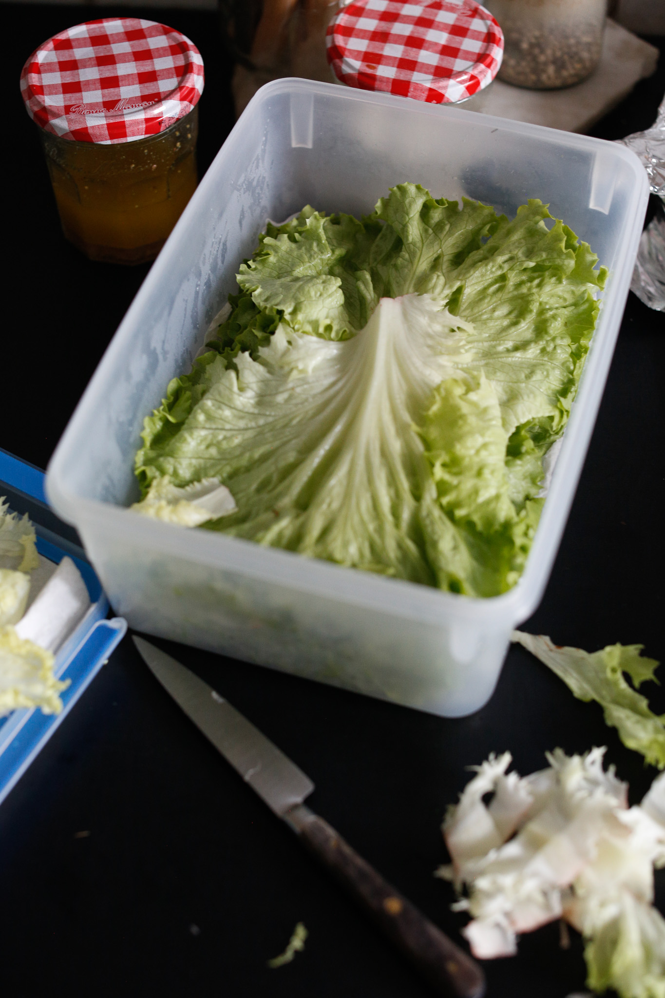 I buy heads of lettuce, wash & dry them and then store them like my grandma did in a tupperware layored with paper towels to absorb the moisture.