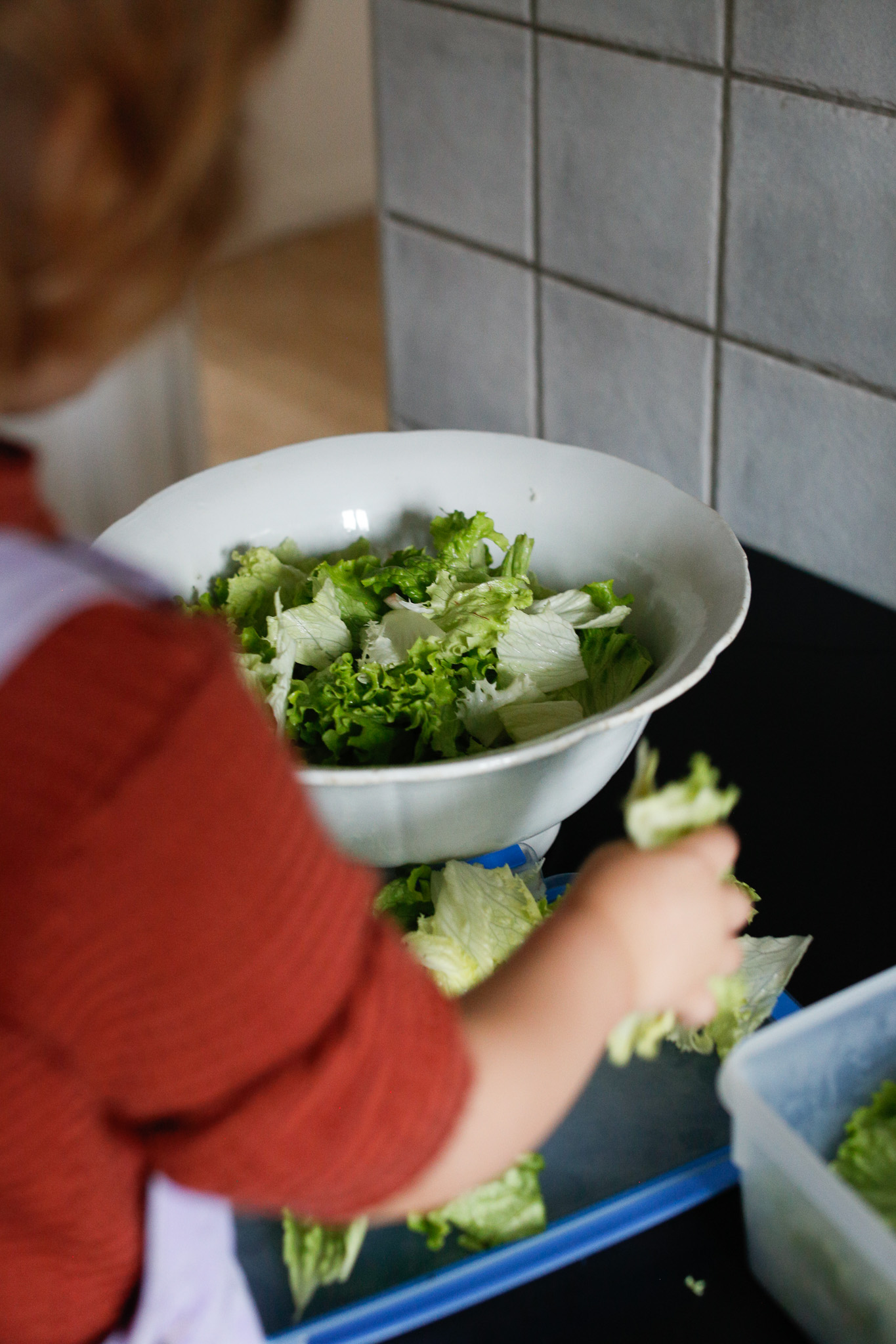 Naturally, she squeezes the salad a bit and I do my best to lightly guide her to gently pick up the salad without being too naggy.
